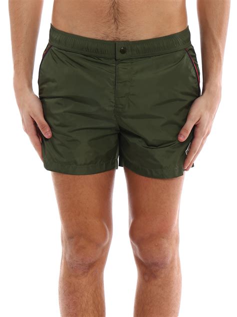 dark green swim shorts.